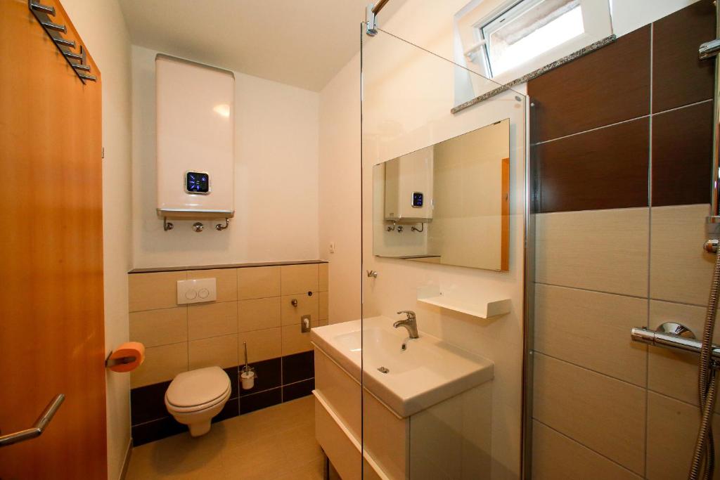 Kúpeľňa v ubytovaní Beach Apartments