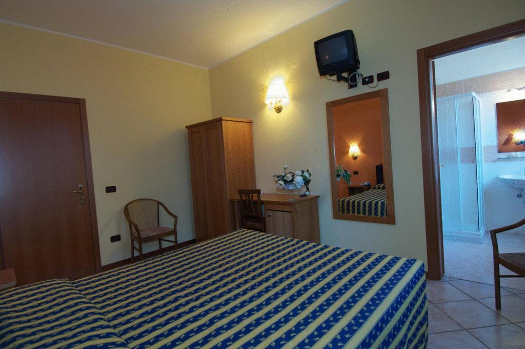 Postel nebo postele na pokoji v ubytování Hotel Il Granaio