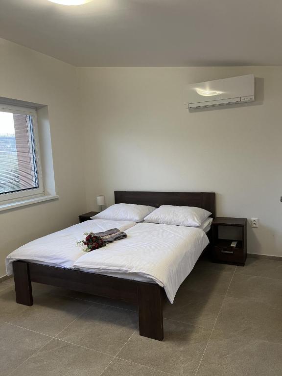 Postel nebo postele na pokoji v ubytování Podhájska - Holiday