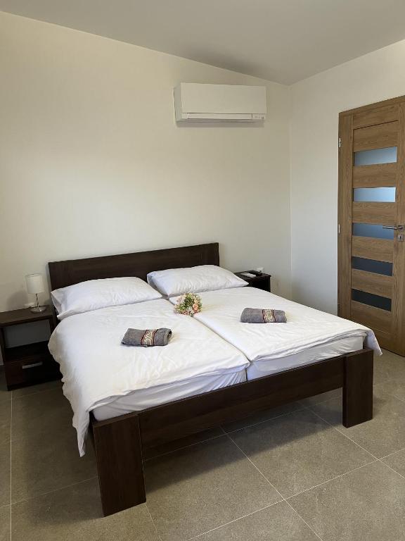 Postel nebo postele na pokoji v ubytování Podhájska - Holiday