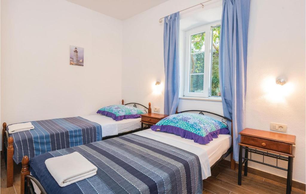 Postel nebo postele na pokoji v ubytování Four-Bedroom Holiday Home In Orebic