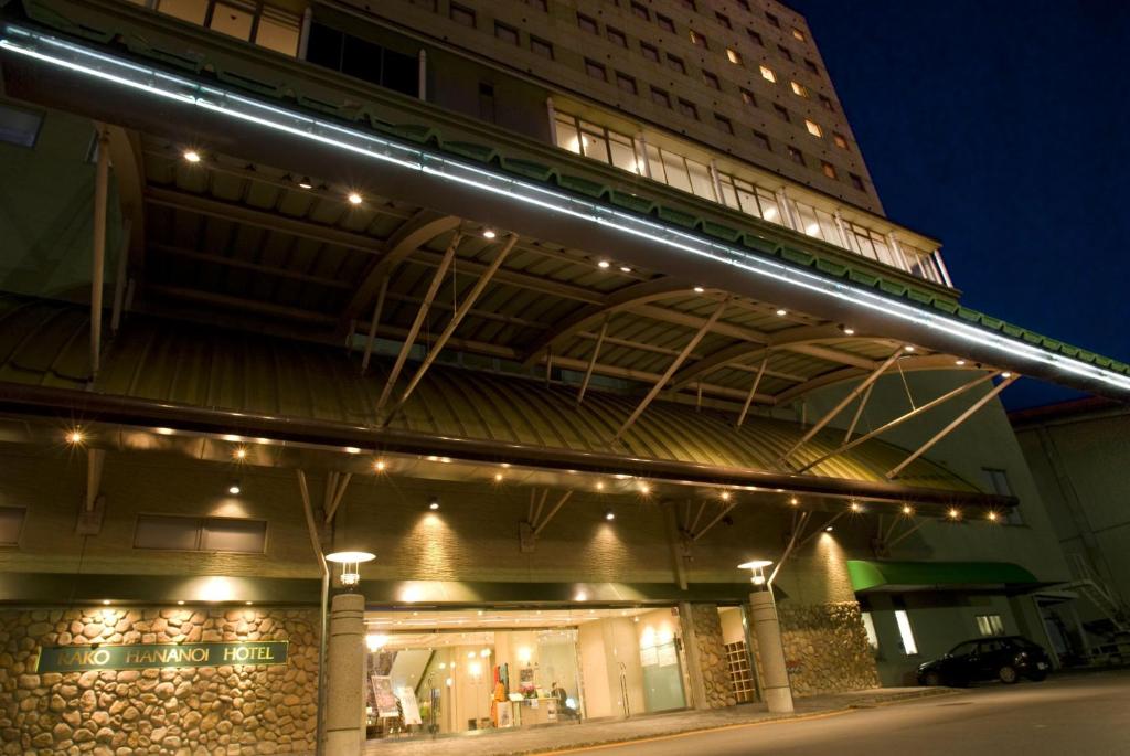 a building with lights on top of it at night at Rako Hananoi Hotel in Suwa