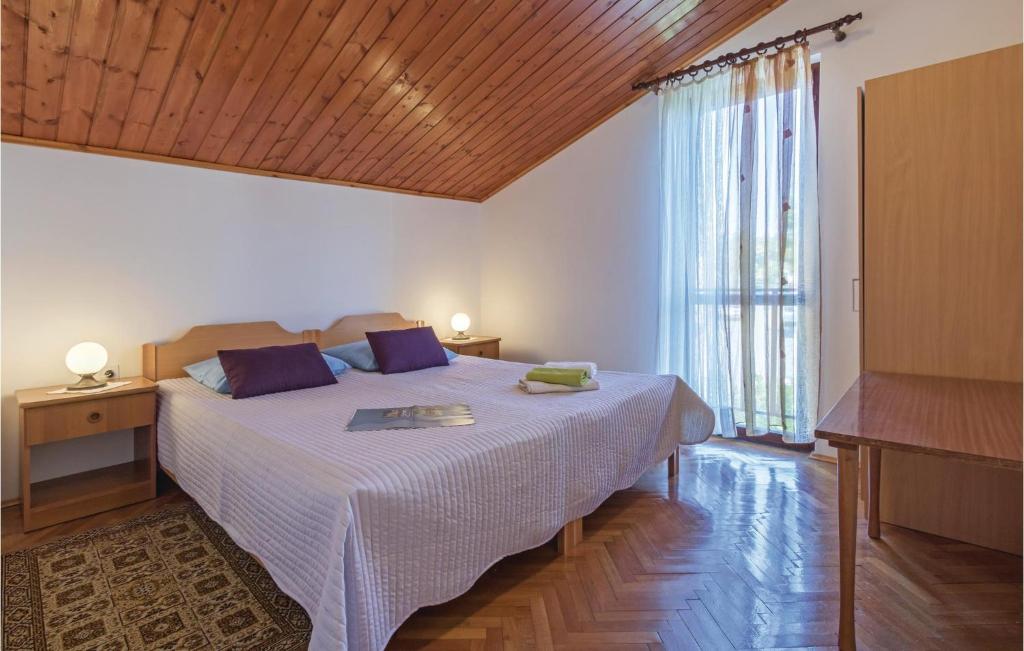 Łóżko lub łóżka w pokoju w obiekcie Holiday Home Pula Pomer