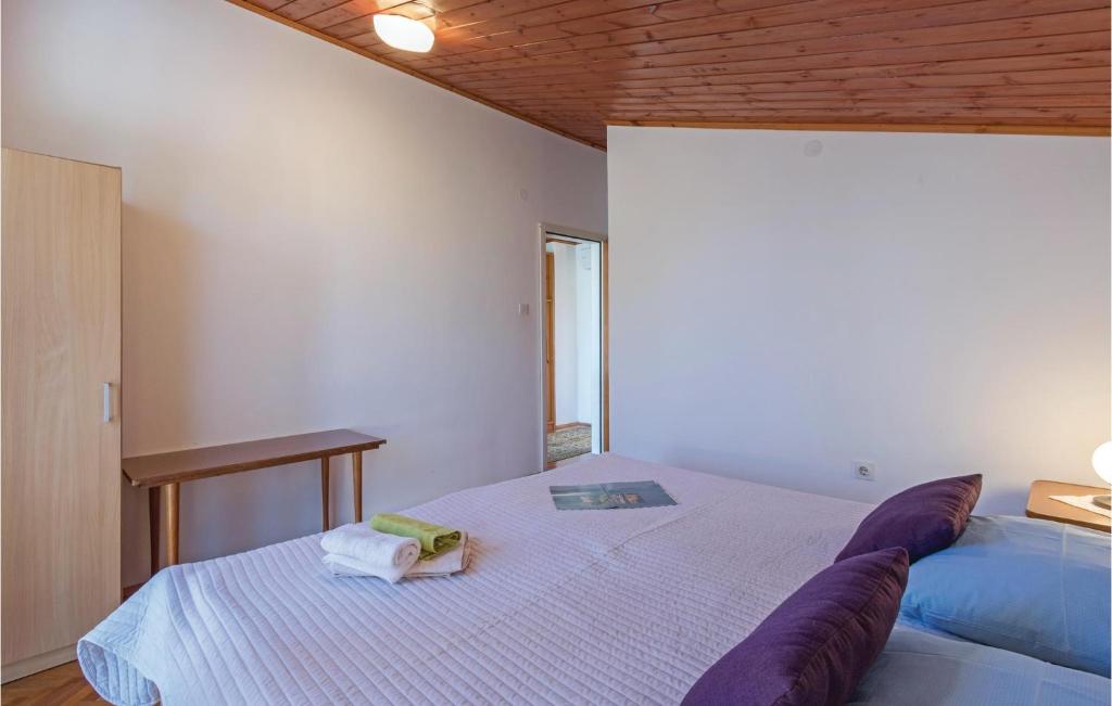 Łóżko lub łóżka w pokoju w obiekcie Holiday Home Pula Pomer