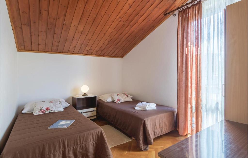 Łóżko lub łóżka w pokoju w obiekcie Holiday Home Pula Pomer