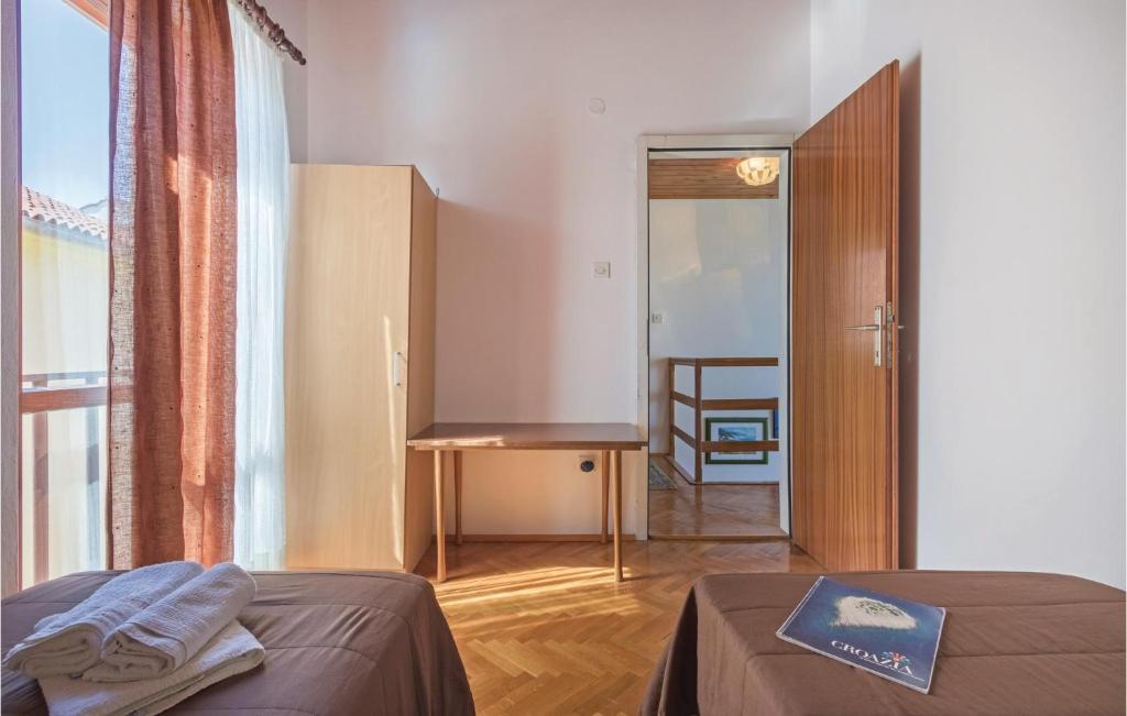 Łóżko lub łóżka w pokoju w obiekcie Holiday Home Pula Pomer