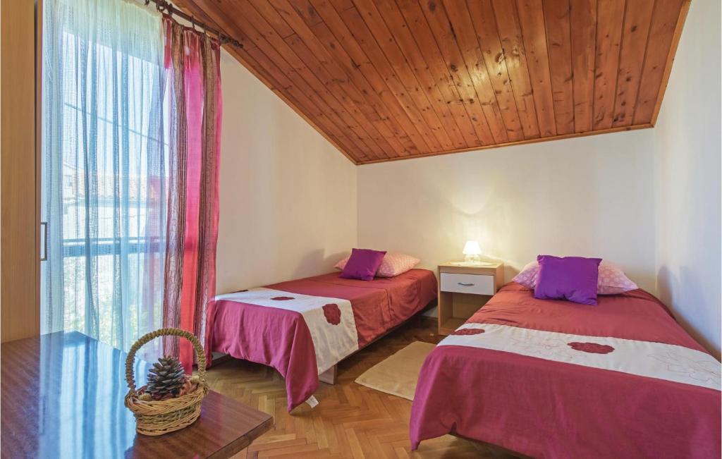 Łóżko lub łóżka w pokoju w obiekcie Holiday Home Pula Pomer