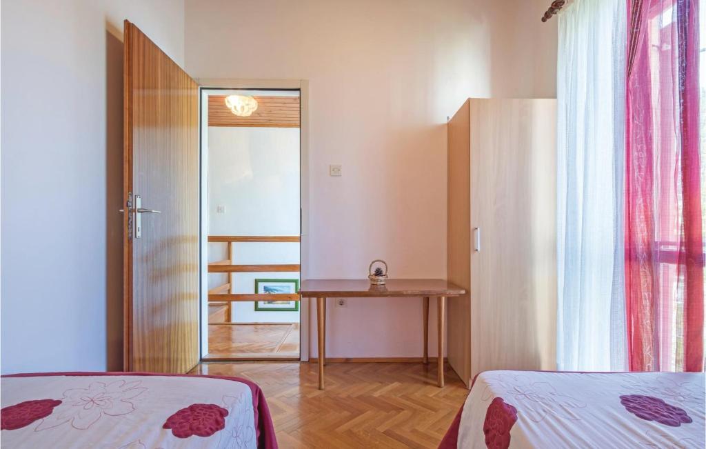Łóżko lub łóżka w pokoju w obiekcie Holiday Home Pula Pomer