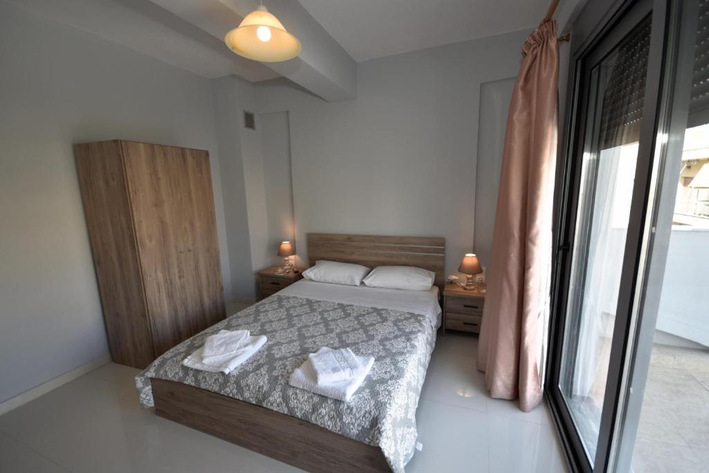 Postel nebo postele na pokoji v ubytování APOSTOLIAS APARTMENTS