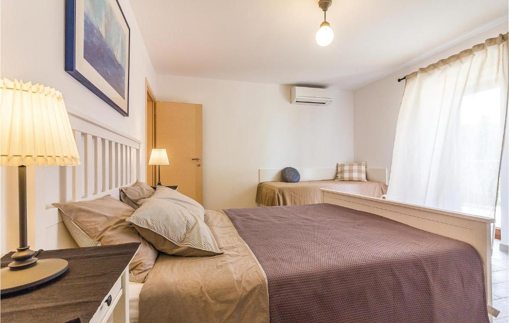 Łóżko lub łóżka w pokoju w obiekcie Holiday Home Medulin Ii