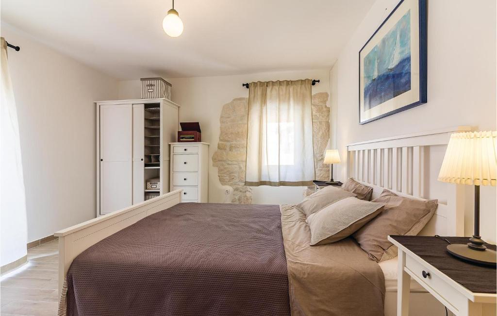 Łóżko lub łóżka w pokoju w obiekcie Holiday Home Medulin Ii