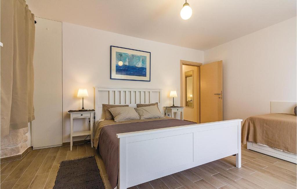 Łóżko lub łóżka w pokoju w obiekcie Holiday Home Medulin Ii
