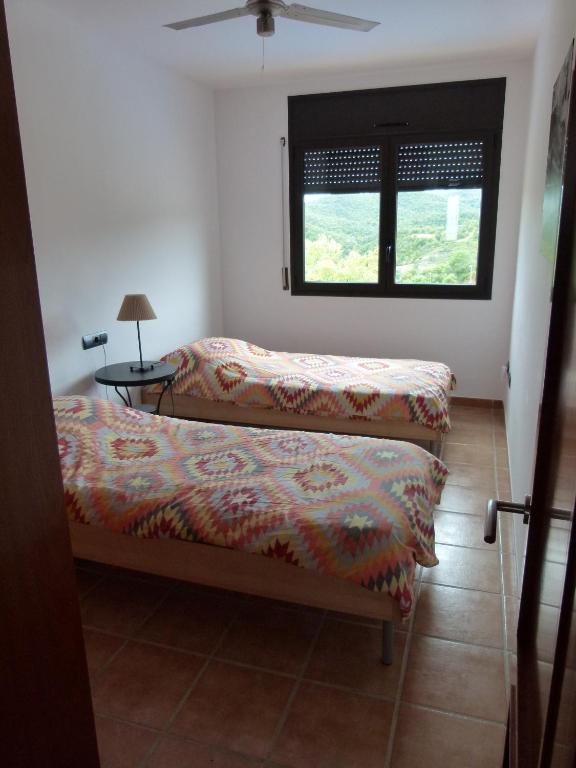 A bed or beds in a room at Villa Vista Bonita with private pool, 4 bedrooms, 9 people