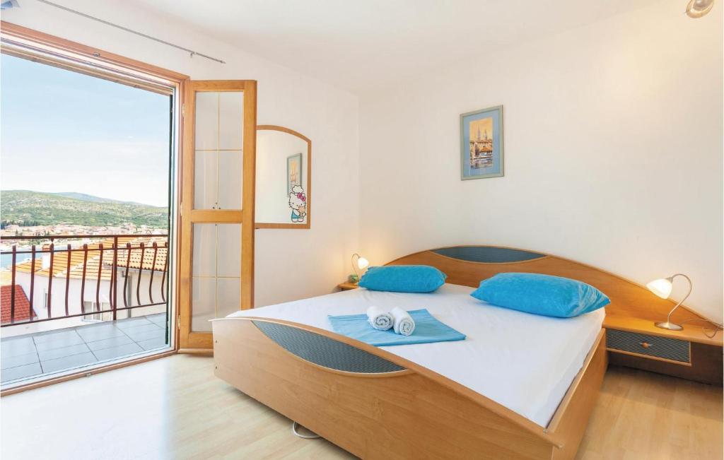 Posteľ alebo postele v izbe v ubytovaní Apartment Trogir Sv,lazara