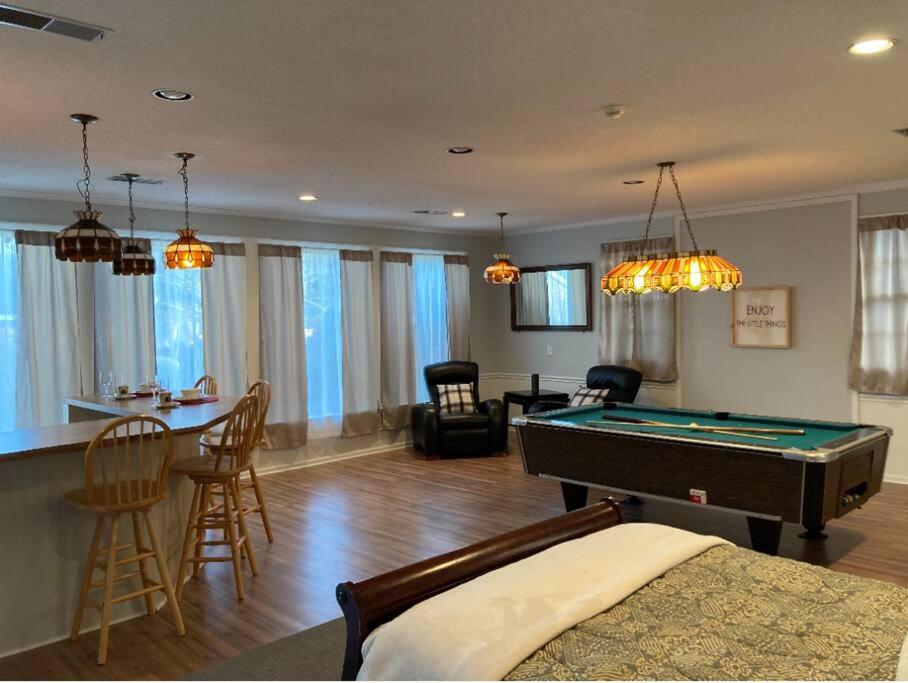 a living room with a pool table and a bar at Welcome to Columbia!-enjoy this tranquil space in Columbia