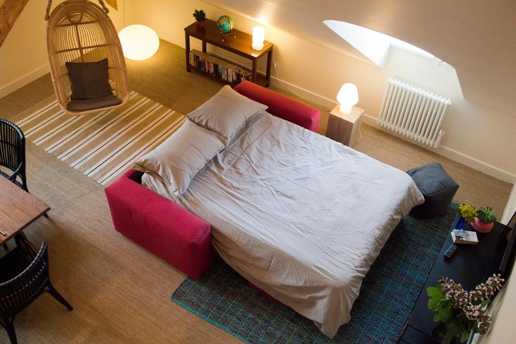 Postel nebo postele na pokoji v ubytování Les Appartements d'Alexandre