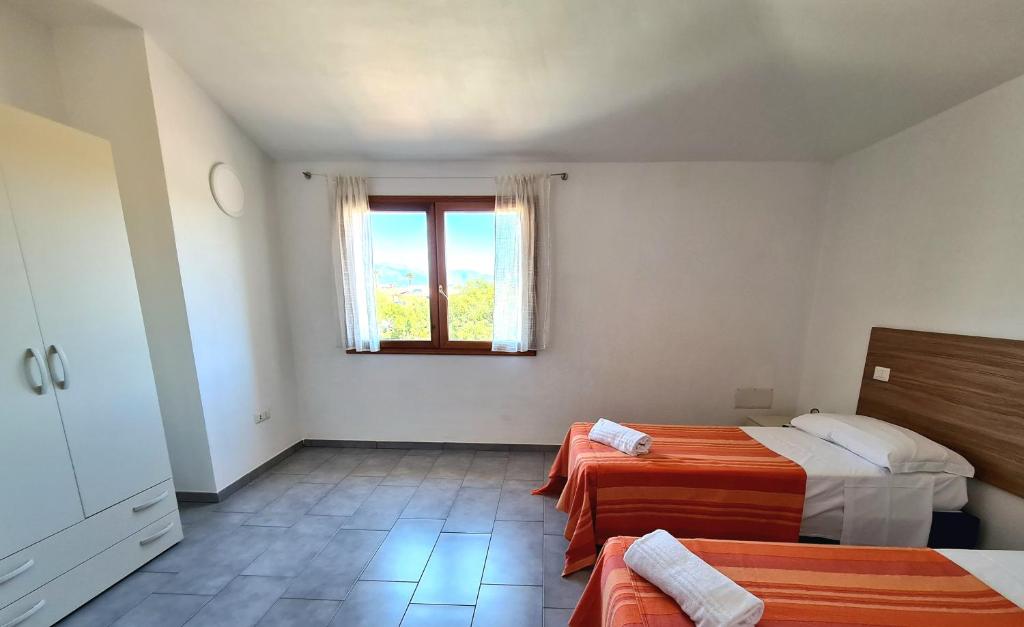 Letto o letti in una camera di Binja Fortuna
