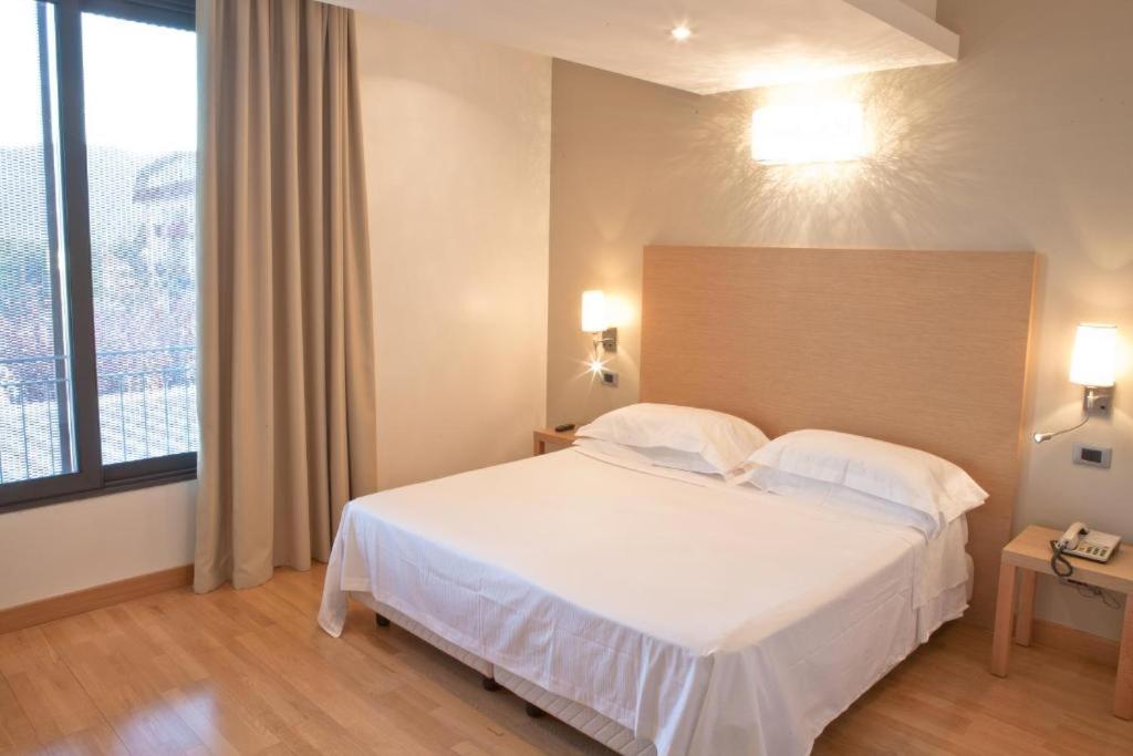 Postel nebo postele na pokoji v ubytování Atlantic Park Hotel