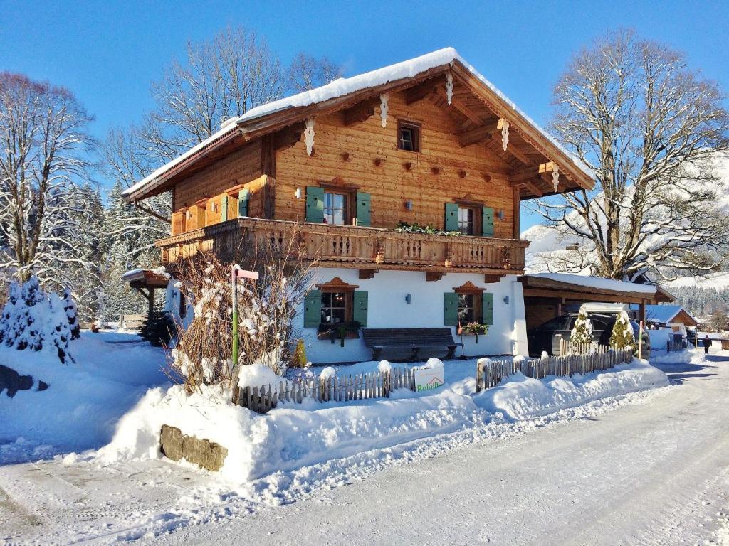 a large wooden house with snow on the ground at Chalet in Ellmau near Ski Slopes in Ellmau