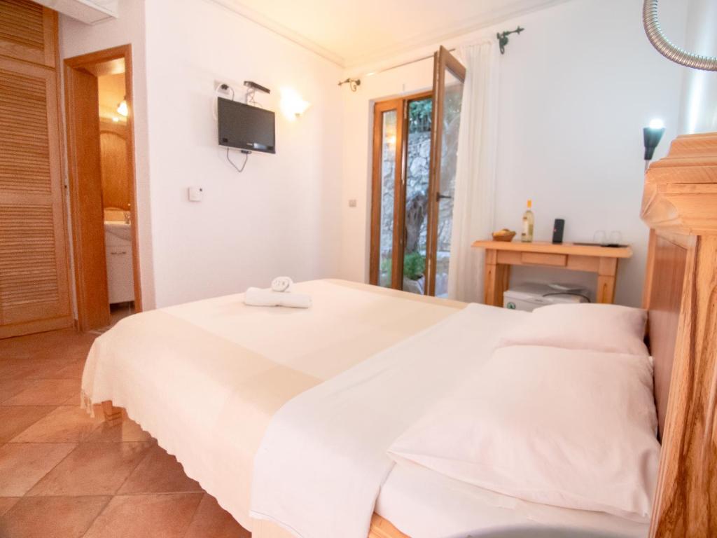 Postel nebo postele na pokoji v ubytování Apartments and Rooms Levantin Inn
