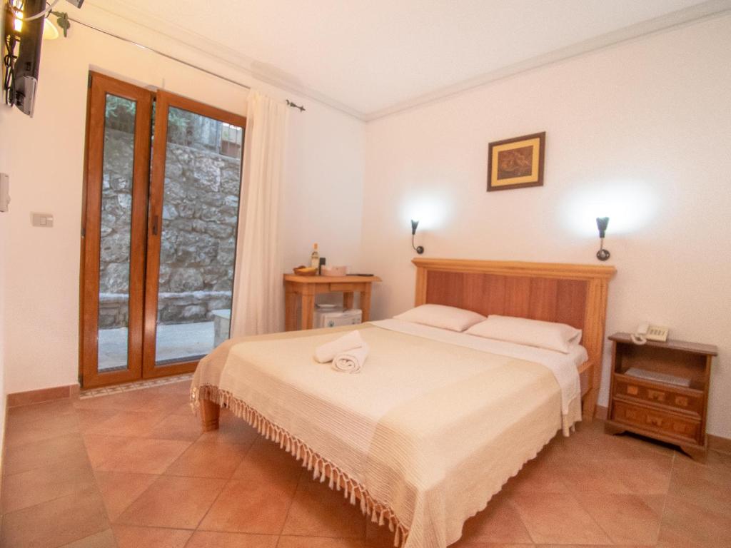 Postel nebo postele na pokoji v ubytování Apartments and Rooms Levantin Inn