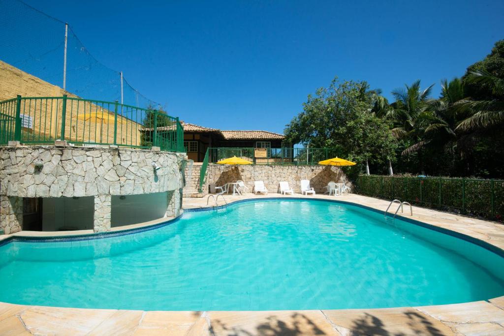Bazén v ubytování Casa em condomínio com piscina na melhor localização de Búzios - água e luz cobrados à parte nebo v jeho okolí