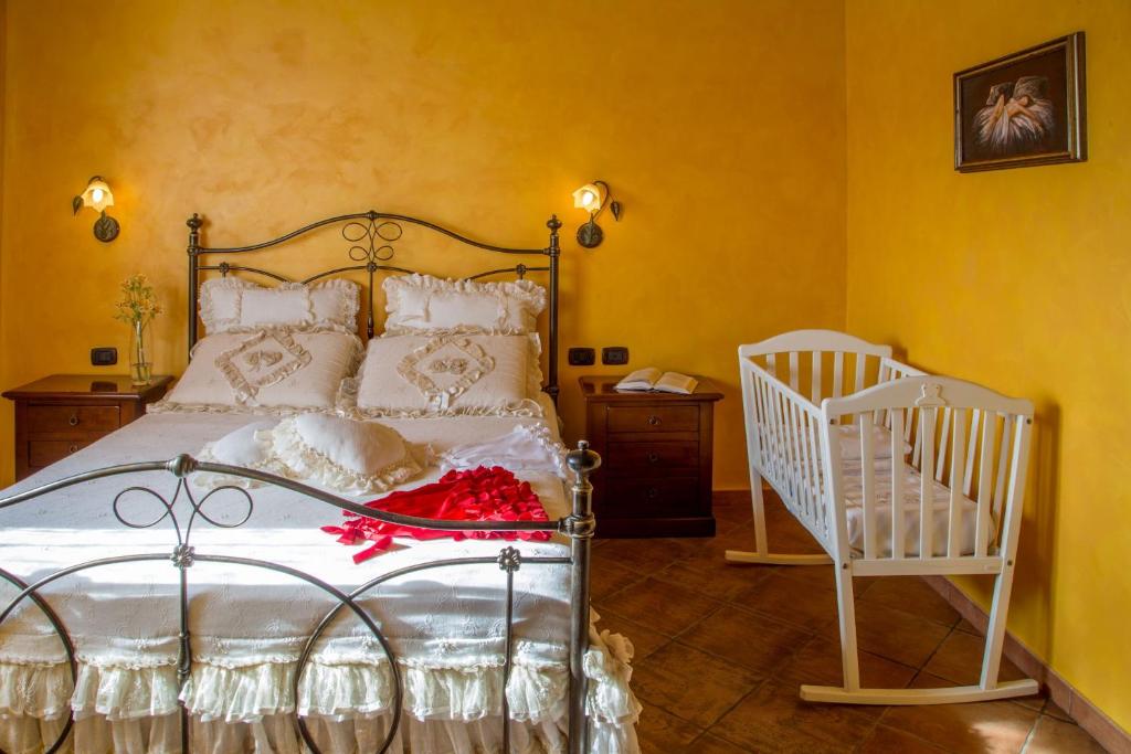 Postel nebo postele na pokoji v ubytování Agriturismo 4 Ricci