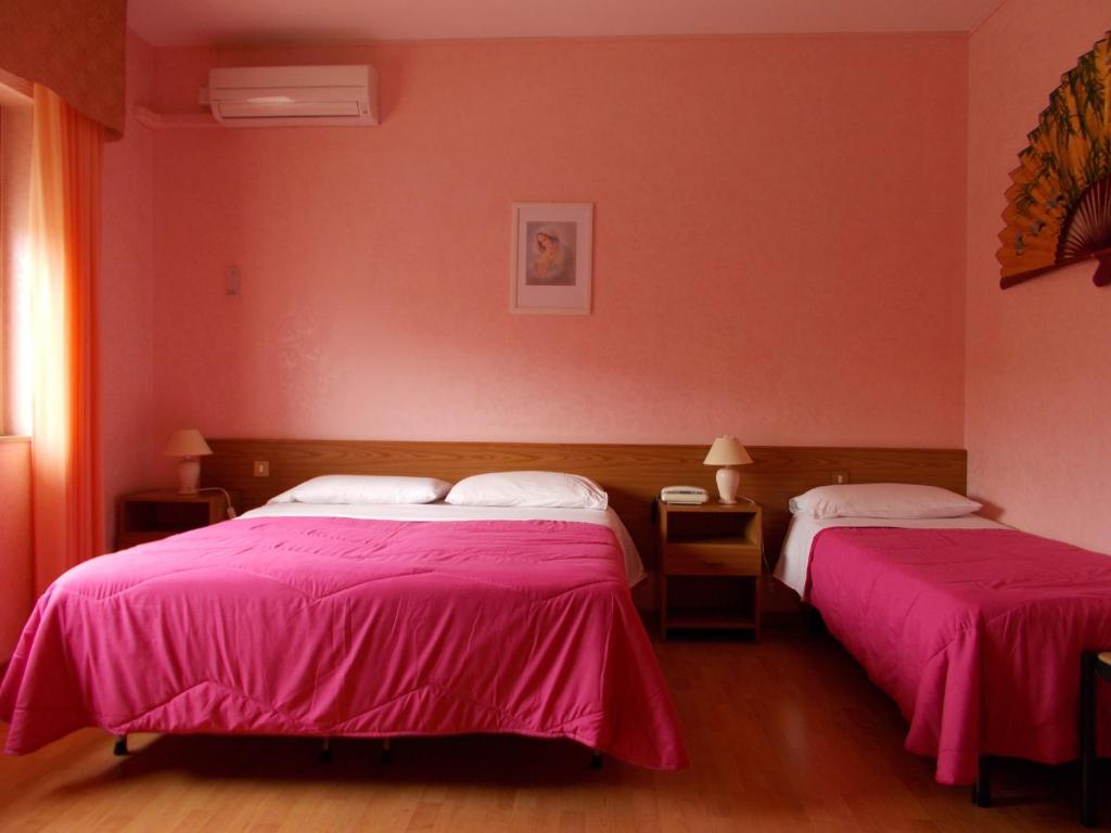 Postel nebo postele na pokoji v ubytování Hotel Maremonti