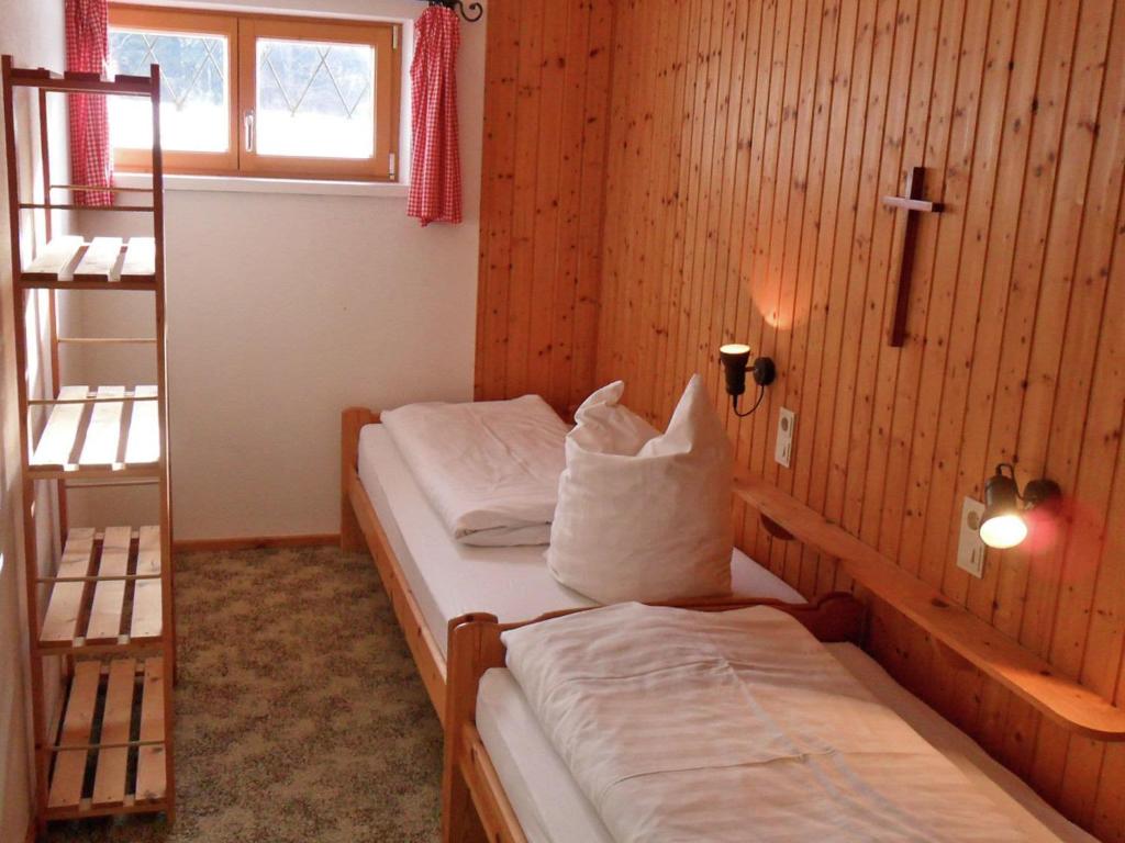 Postel nebo postele na pokoji v ubytování Holiday home in Sibratsgfäll in the Bregenzerwald