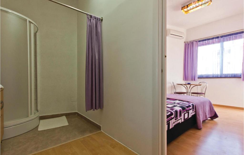 Postel nebo postele na pokoji v ubytování Holiday Home Pomer Pomer