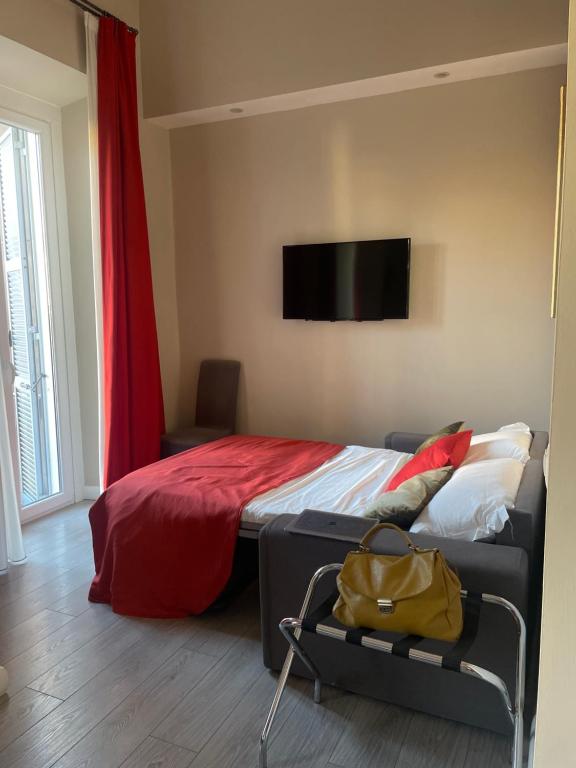 Televízia a/alebo spoločenská miestnosť v ubytovaní The Roman Empire Guesthouse