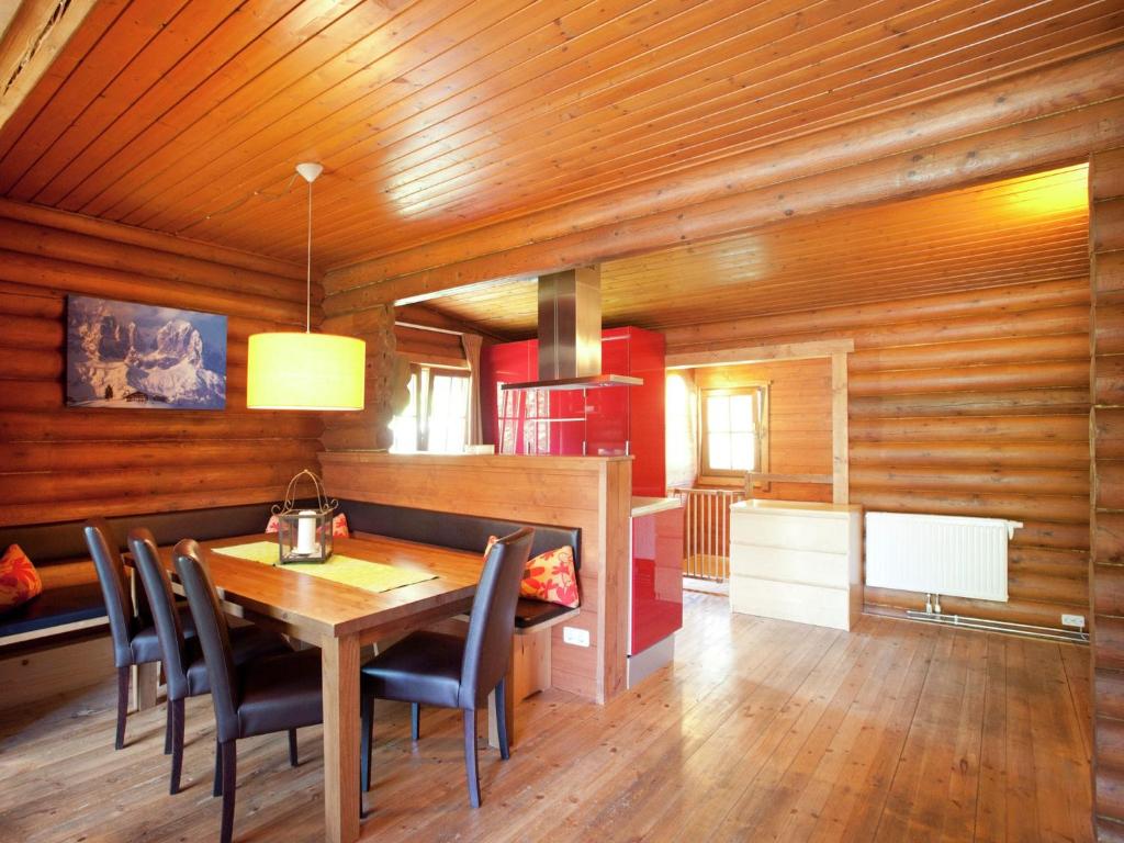 a dining room with a table and chairs at Forest chalet in Wörgl near SkiWelt Wilder Kaiser in Wörgler Boden