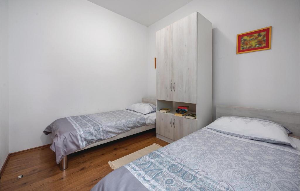 Łóżko lub łóżka w pokoju w obiekcie Holiday Home Breg V