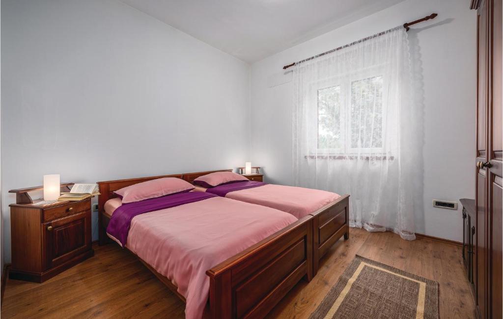 Łóżko lub łóżka w pokoju w obiekcie Holiday Home Breg V