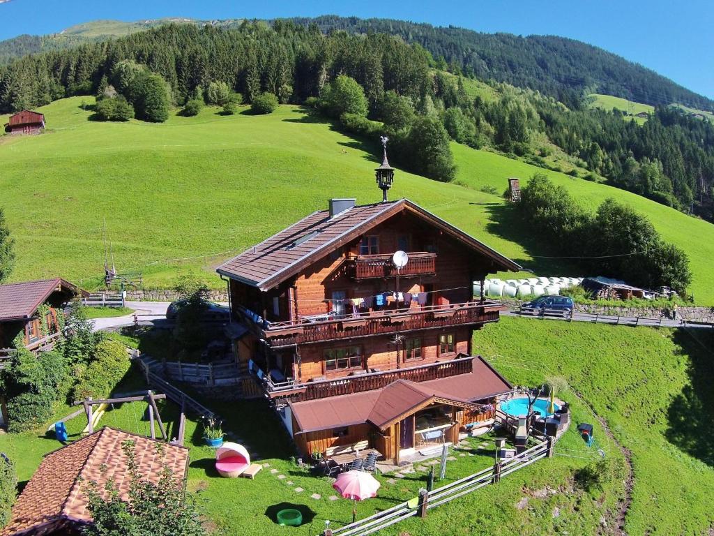 an aerial view of a house on a hill at Beautiful Mountainside Chalet in K nigsleiten in Wald im Pinzgau