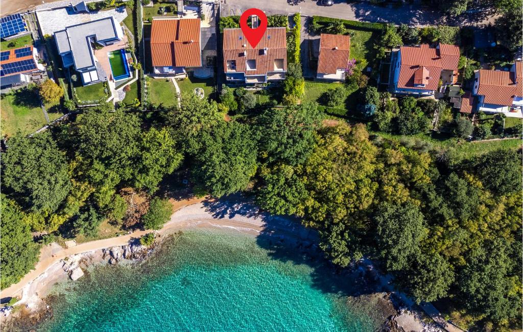 an aerial view of a beach with a red marker at Nice Apartment In Njivice With Wifi in Njivice