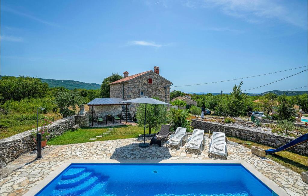 a villa with a swimming pool and a house at Gorgeous Home In Burjaki With Kitchen in Trgetari