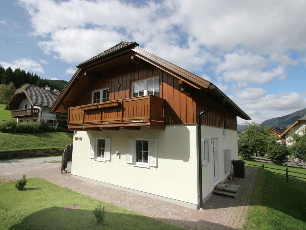 a small house with a wooden roof at Holiday home in Salzburg Lungau near the ski slope in Sankt Margarethen im Lungau
