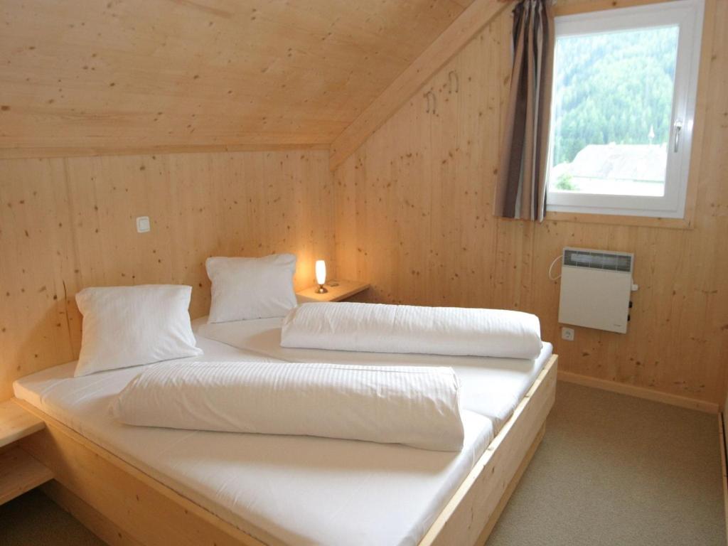 A bed or beds in a room at Chalet Hohentauern by Ski Lift