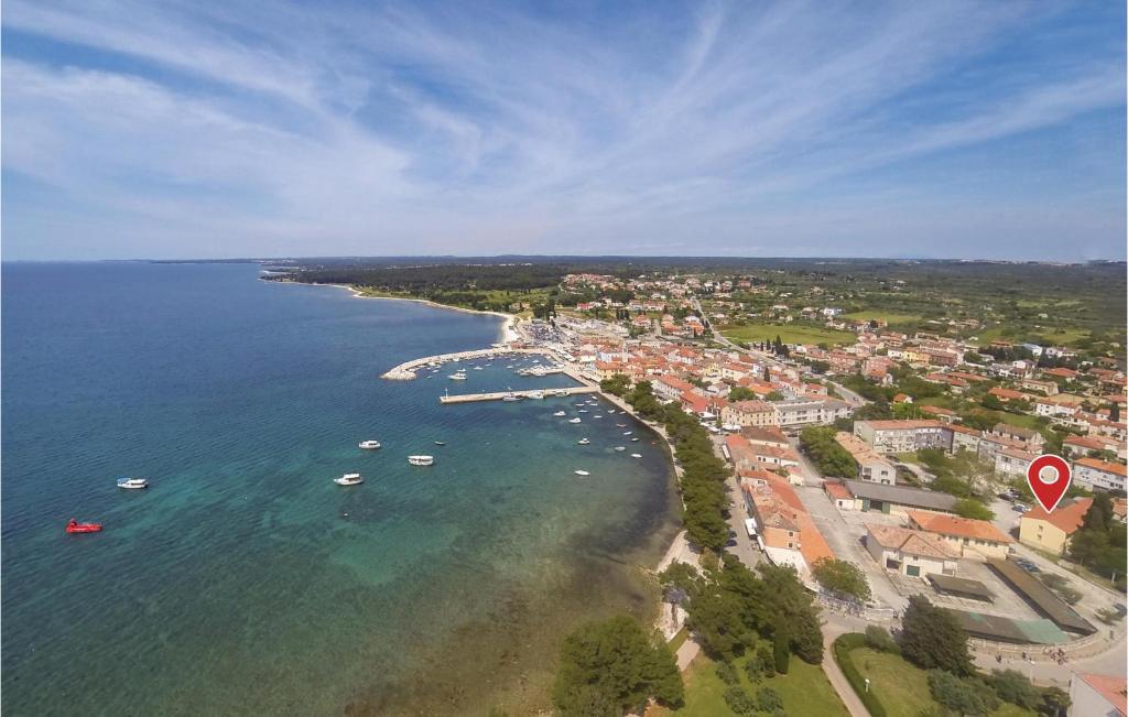 an aerial view of a beach with boats in the water at Apartment Fazana 09 in Fažana
