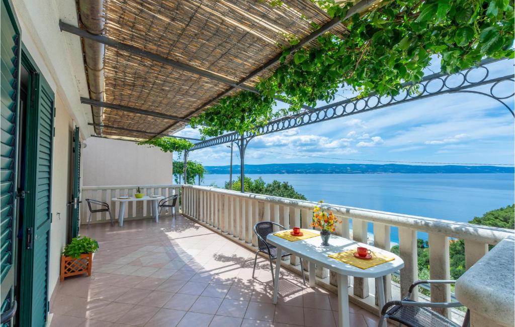 a balcony with a view of the water at Cozy Apartment In Omis With House Sea View in Zakučac