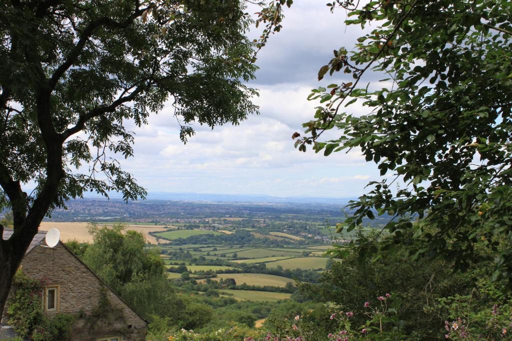 a view of the countryside from a hill with trees at Pathways, Beachwood Cottage in Bath