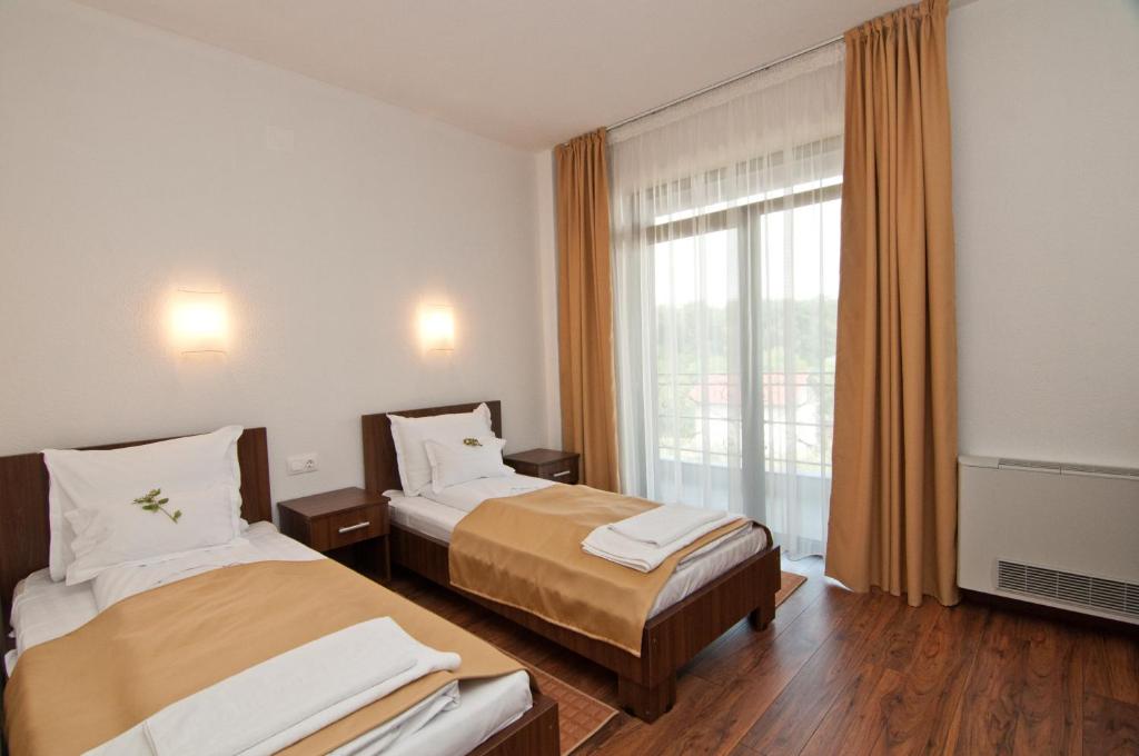 Postel nebo postele na pokoji v ubytování Hotel Hyperion