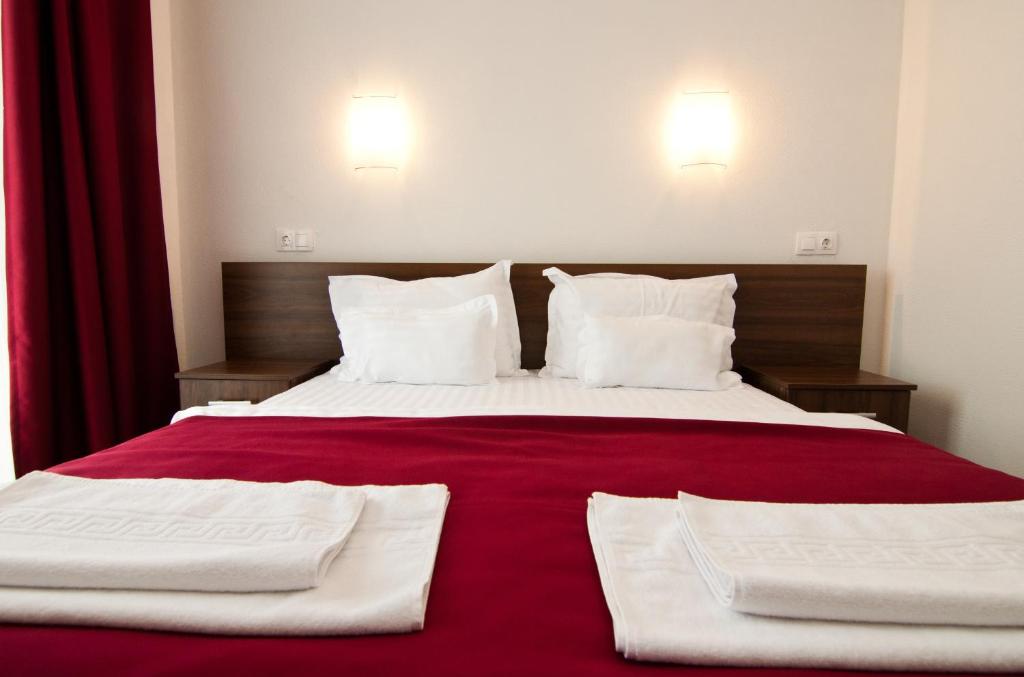 Postel nebo postele na pokoji v ubytování Hotel Hyperion