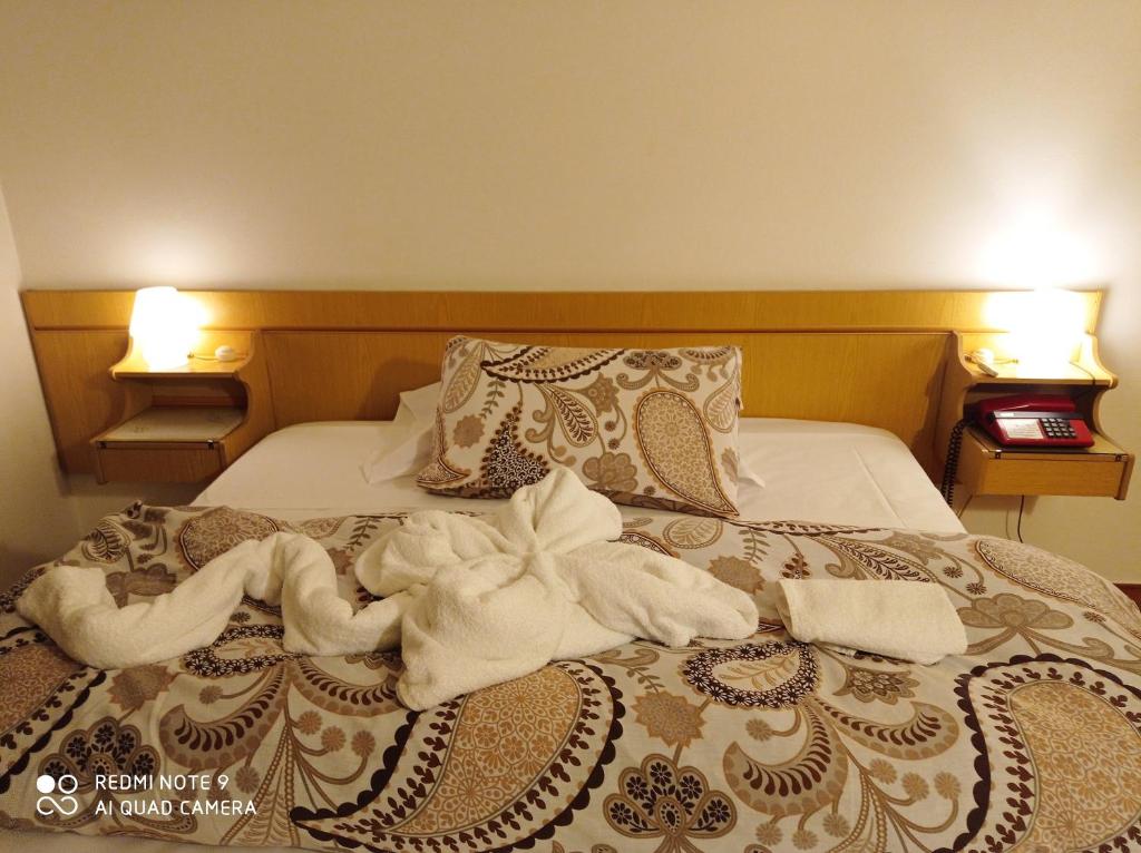 Postel nebo postele na pokoji v ubytování Mini hotel