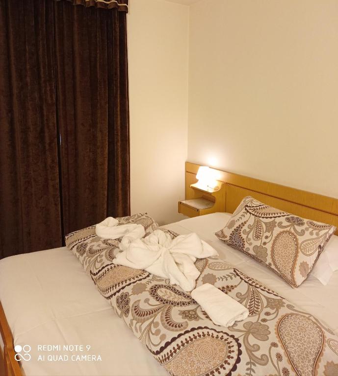 Postel nebo postele na pokoji v ubytování Mini hotel