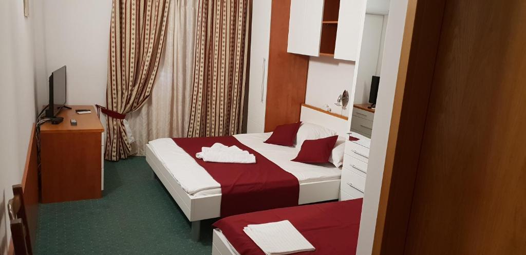 Postel nebo postele na pokoji v ubytování Pansion Laguna