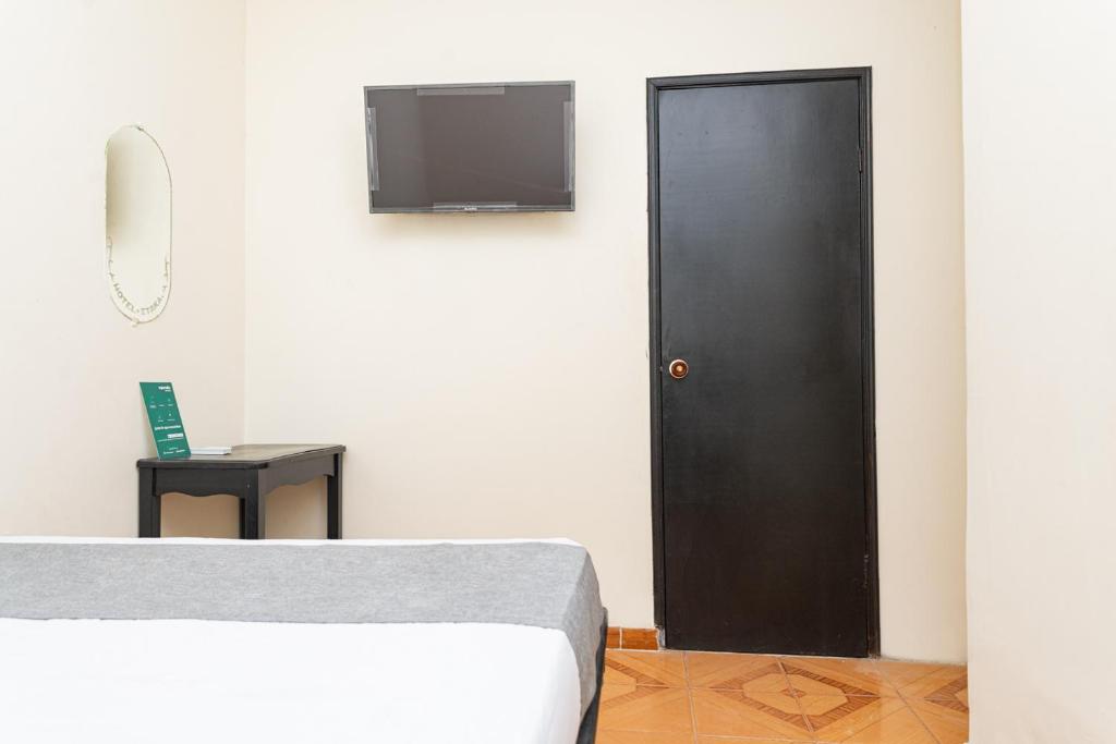 TV a/nebo společenská místnost v ubytování Hotel Itaka