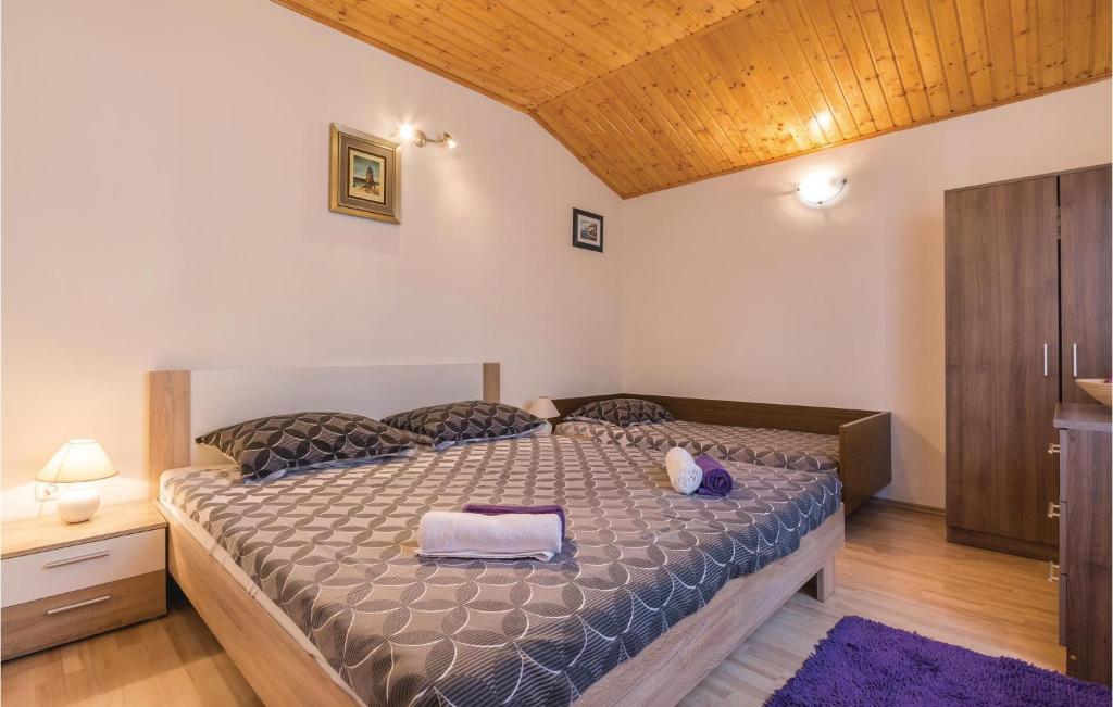 Postel nebo postele na pokoji v ubytování One-Bedroom Apartment In Fazana