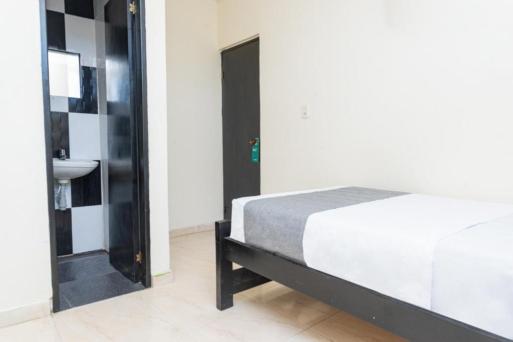 Postel nebo postele na pokoji v ubytování Hotel Itaka